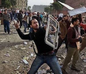 Clashes as tens of thousands flood Tahrir Square to mark Egypt revolt